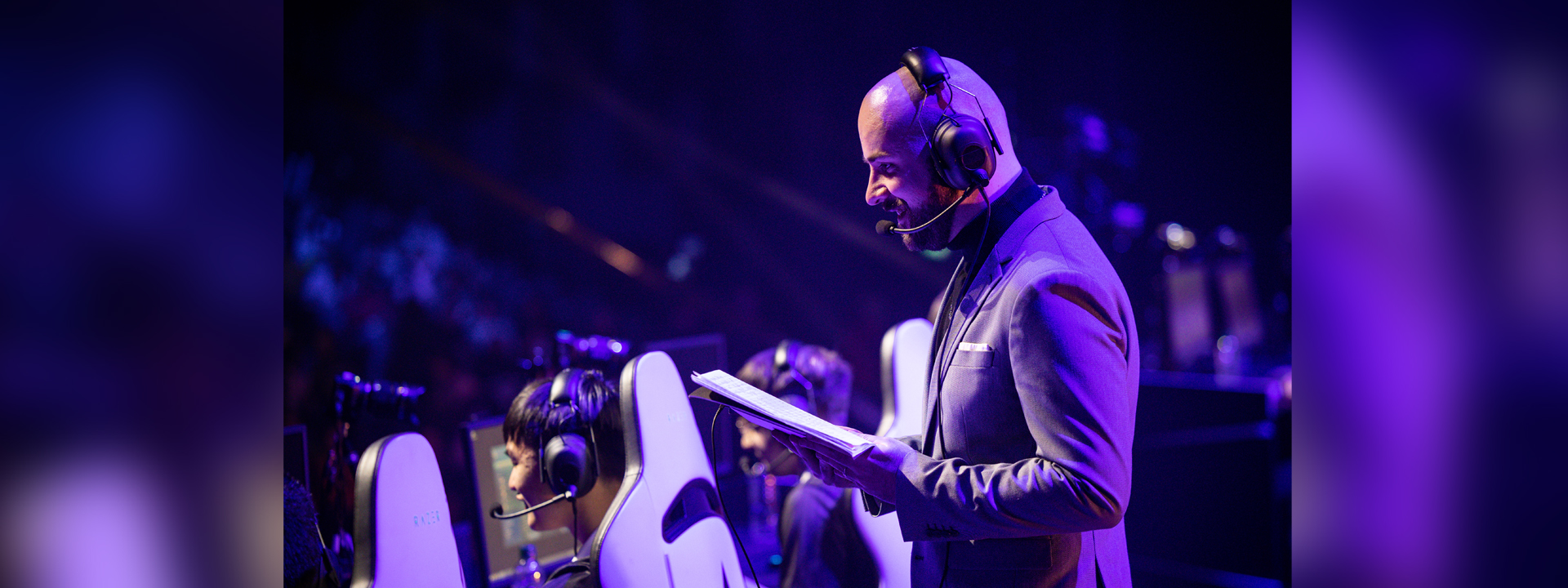 A bald guy with a headset.